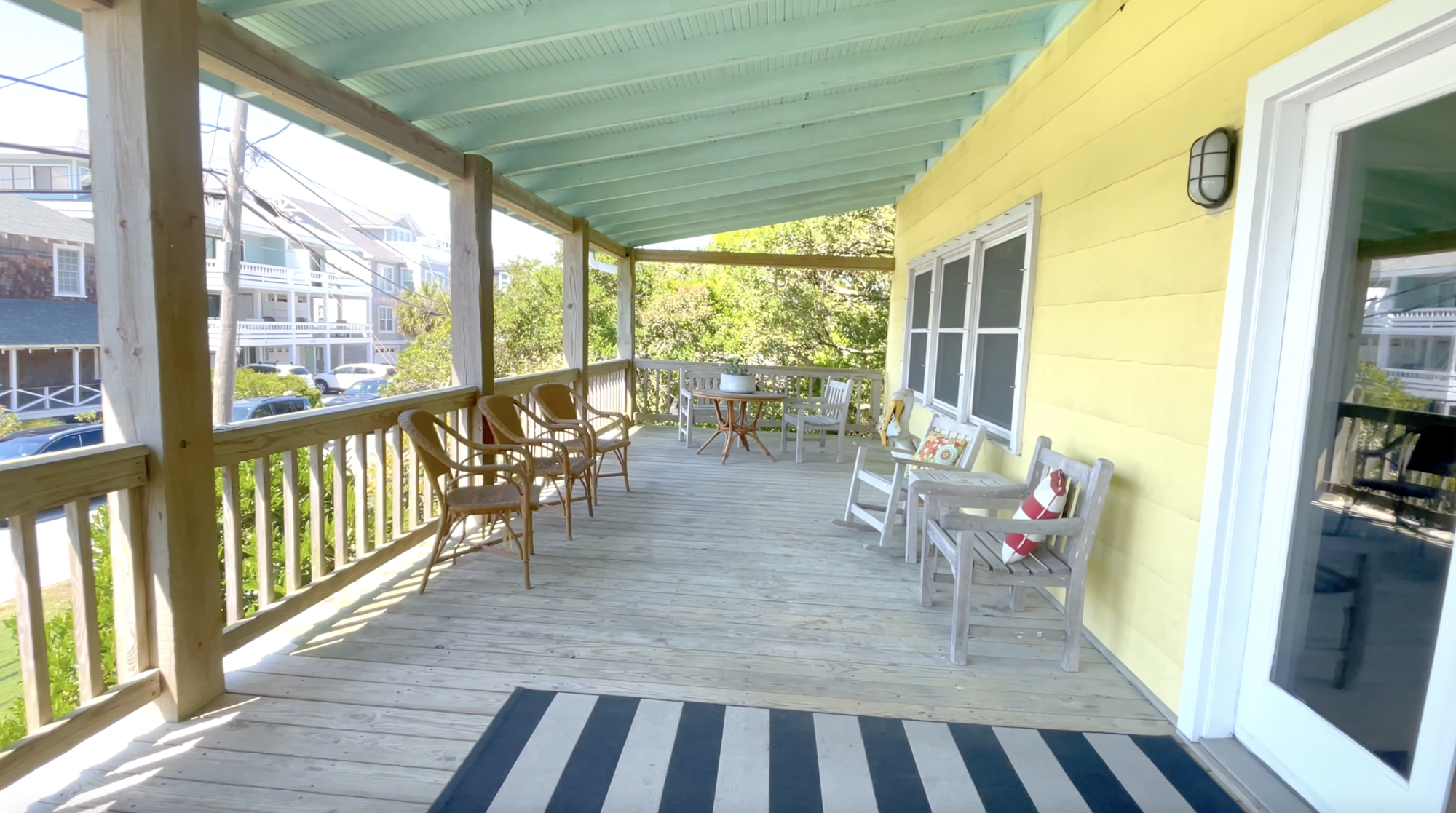 Outdoor deck and seating at The Cottage at Blockade Runner Beach Resort.