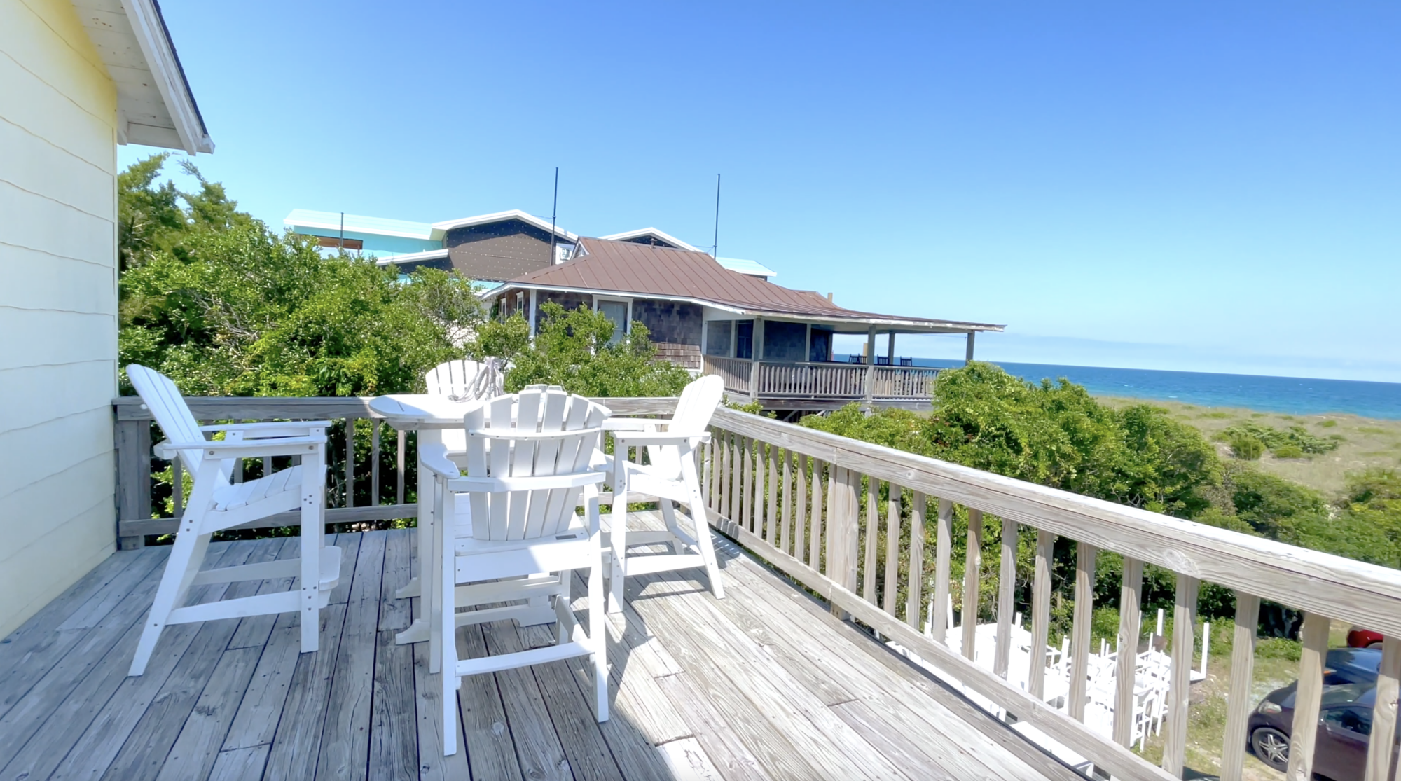 Oceanfront outdoor deck and seating area at Wrightsville Beach cottage at Blockade Runner.
