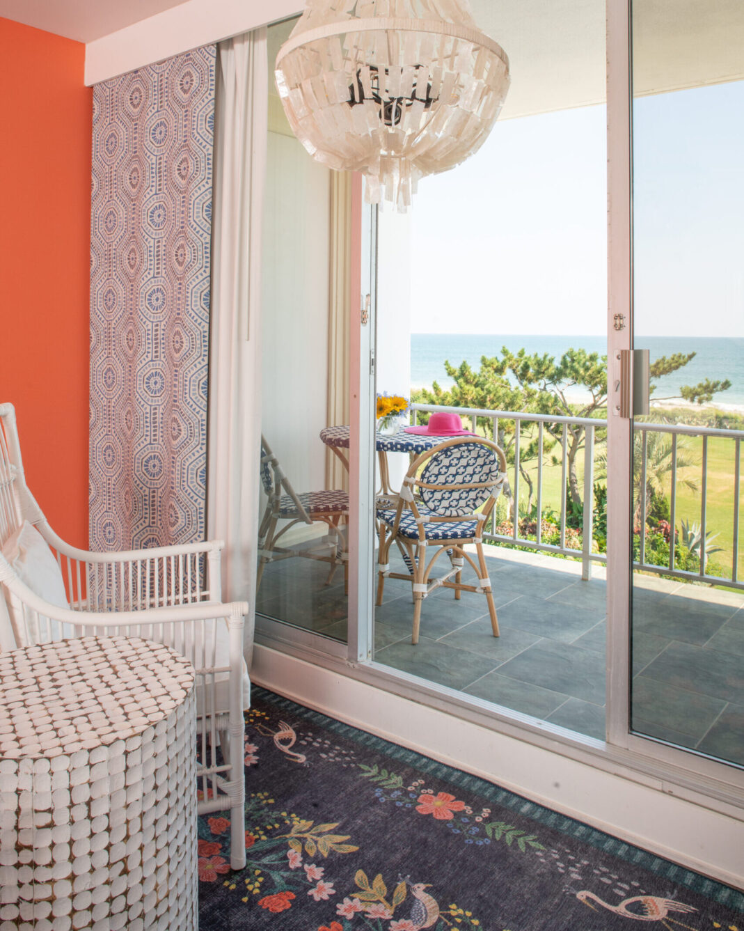 Hanging light fixture and outdoor balcony with an oceanfront view at Blockade Runner.