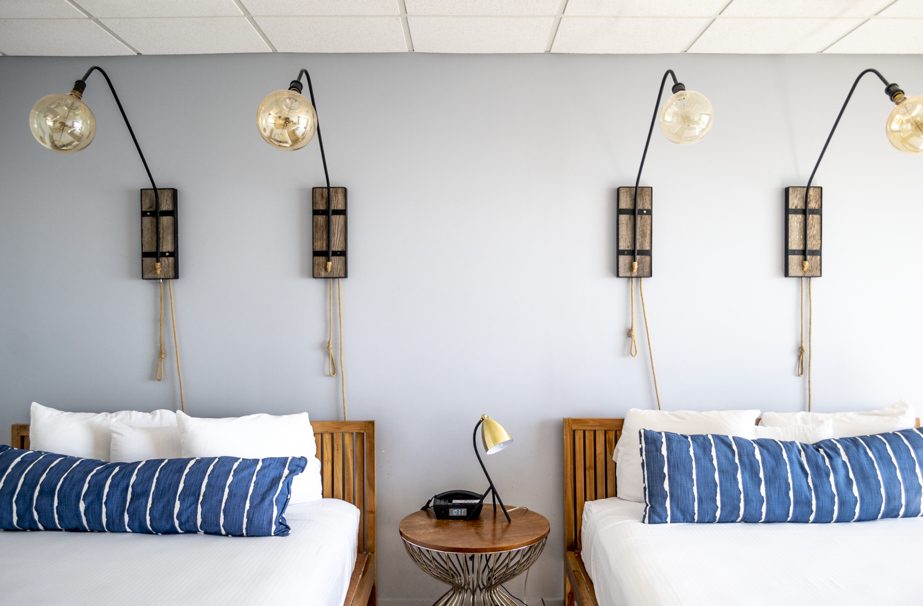 Double Queen Room on Club Level queen beds and fixture decor at Blockade Runner.